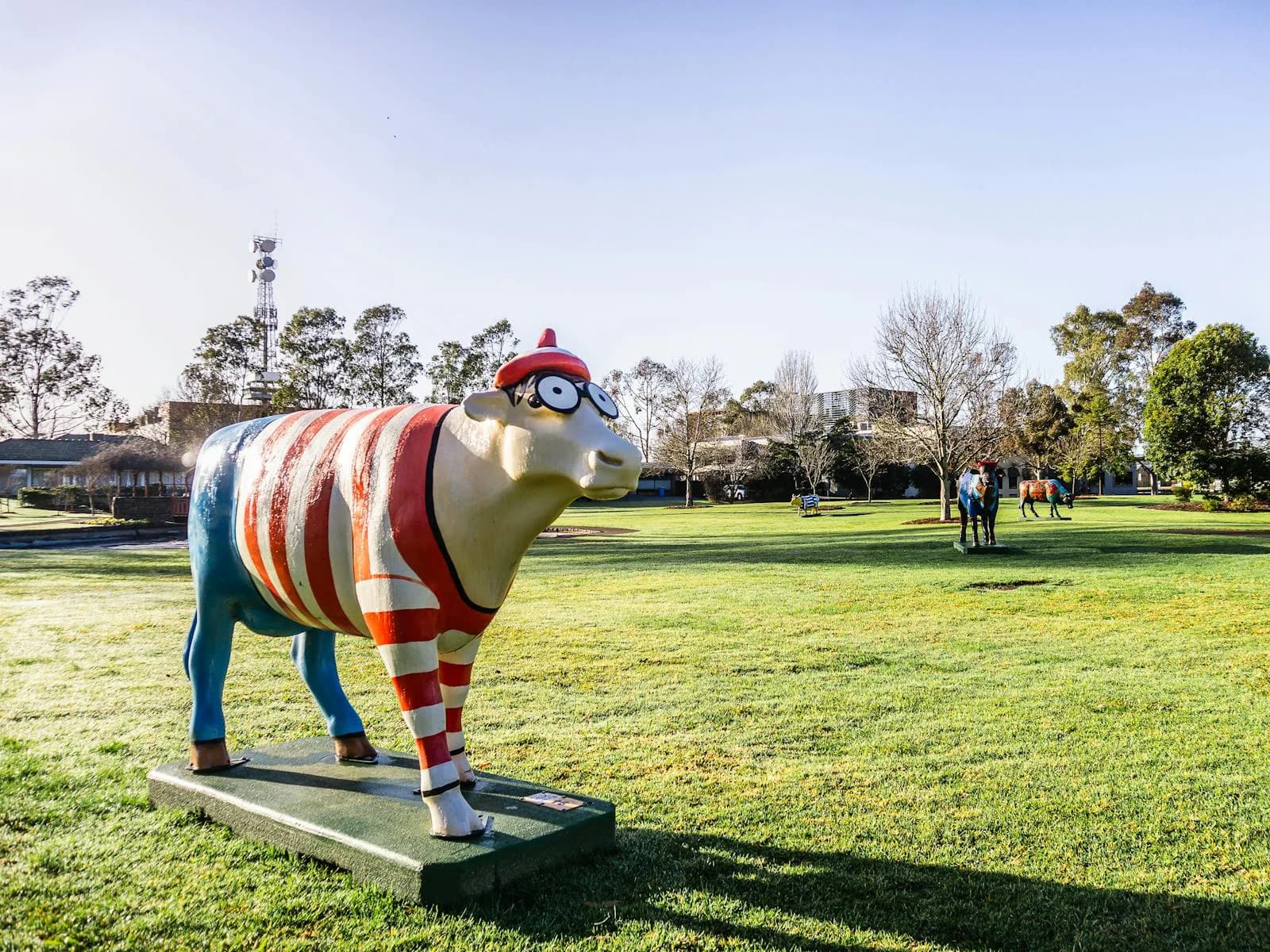 Painted Moooving Art cows in a Shepparton park, Victoria, where Hike ranks local businesses on Google